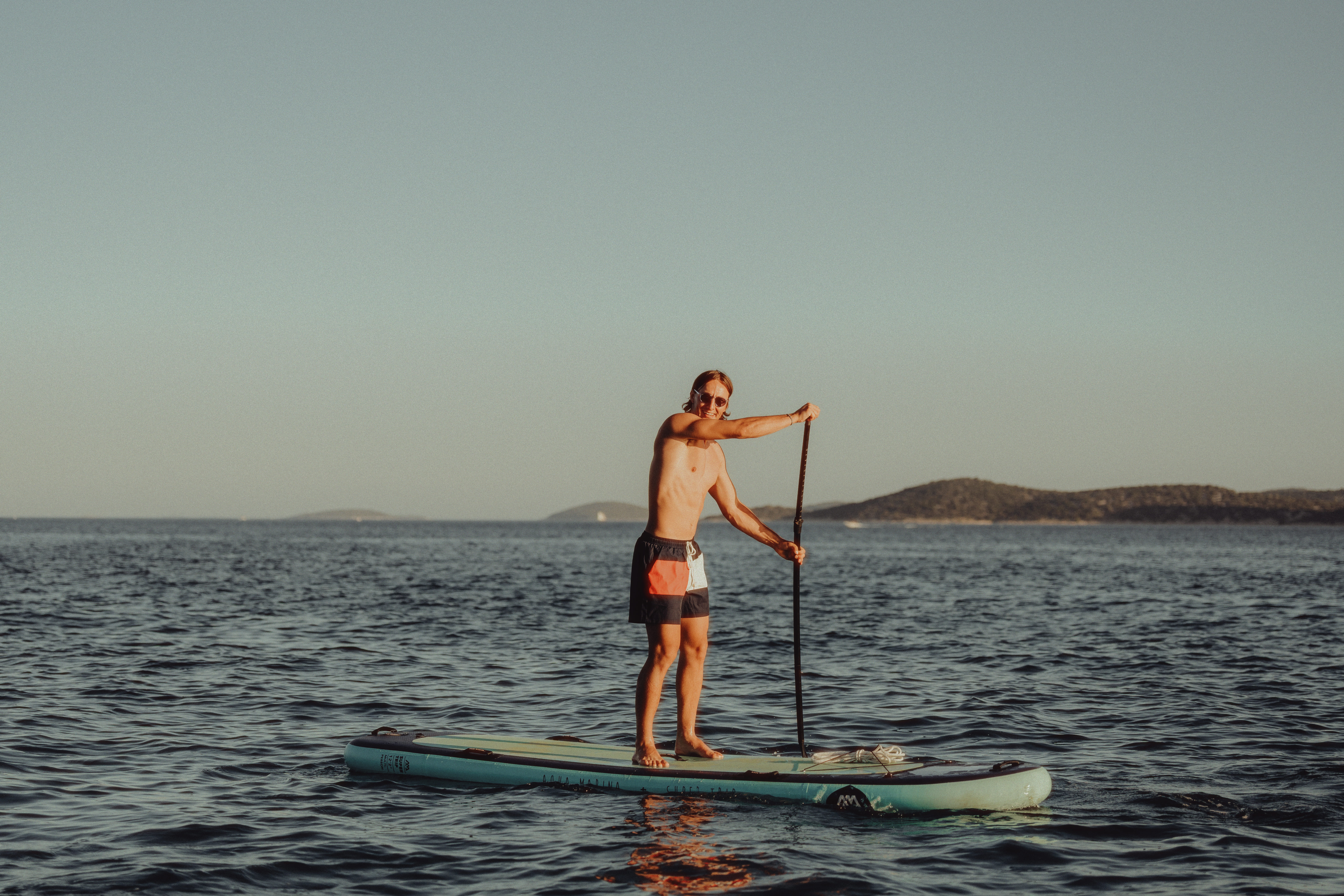 Stand up paddle on the calm Adriatic sea at Plava plaža, Vodice